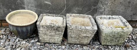 A set of three reconstituted stone planters of square form together with a stoneware jardiniere