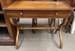 A modern continental side table with a rectangular top above a frieze drawer on X frame legs united