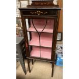 An Edwardian mahogany display cabinet with painted decoration with a glass door and sides on square