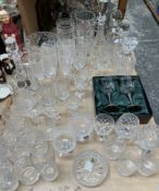 Cut glass decanters together with drinking glasses, jugs,