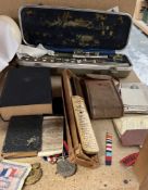 A Boosey and Hawkes Regent flute, together with world war II, medals, service book, photographs,