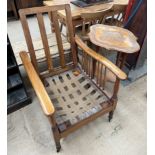 A reclining chair with stick supports together with a continental carved occasional table