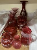 Assorted cranberry glass including vases, jugs,