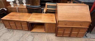A mid 20th century teak bureau together with a similar side cabinet,