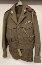 An Army uniform with Essex regiment shoulder patches