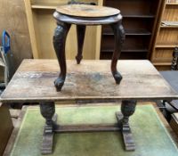A 20th century oak coffee table with a rectangular top on carved legs together with a stool with
