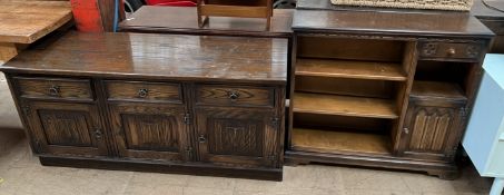 A 20th century oak sideboard with a linen fold panelled front together with a matching bookcase