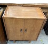 A mid 20th century teak record cabinet on tapering legs