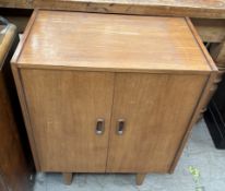 A mid 20th century teak record cabinet on tapering legs