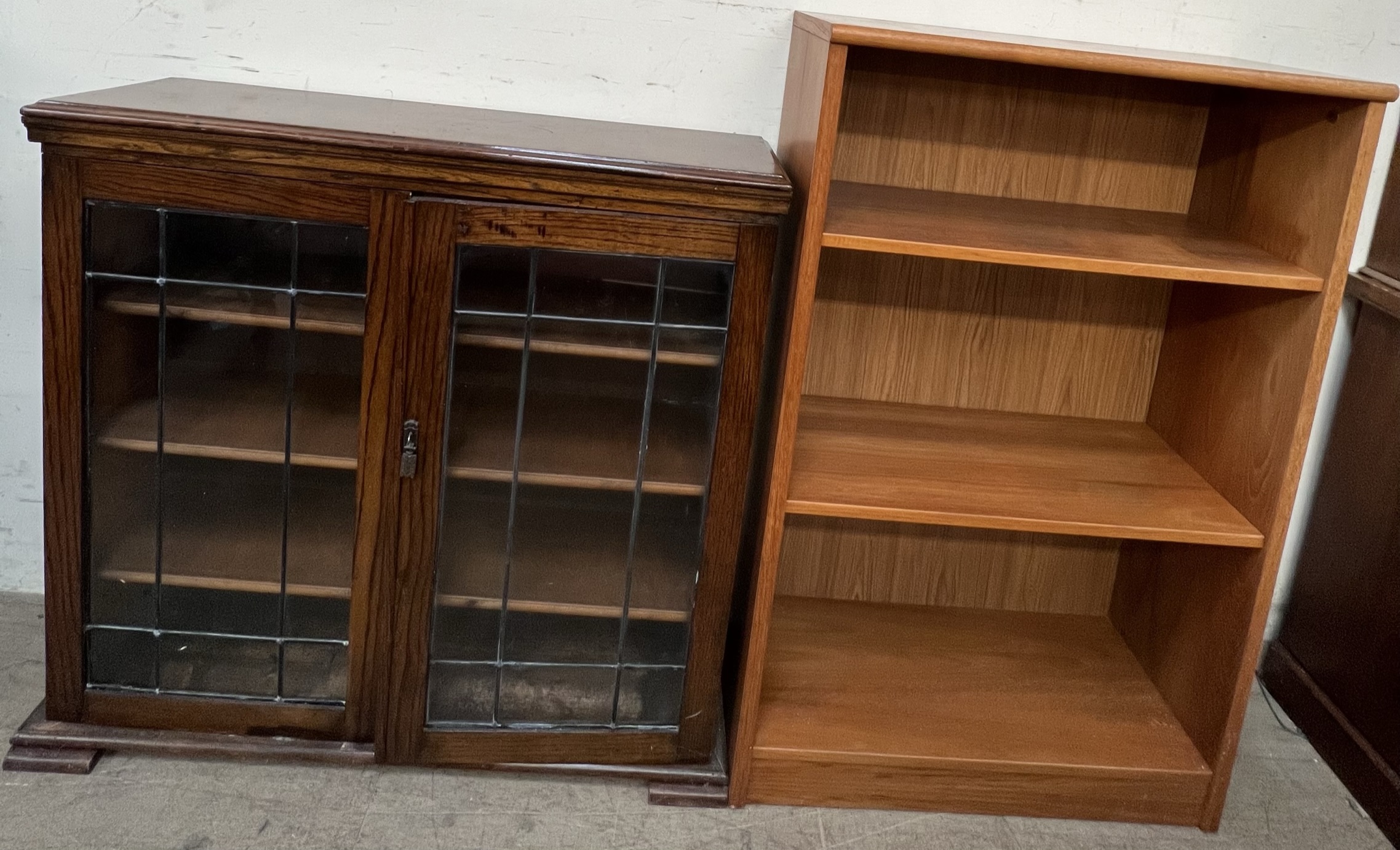 A mid 20th century teak bookcase together with an oak bookcase