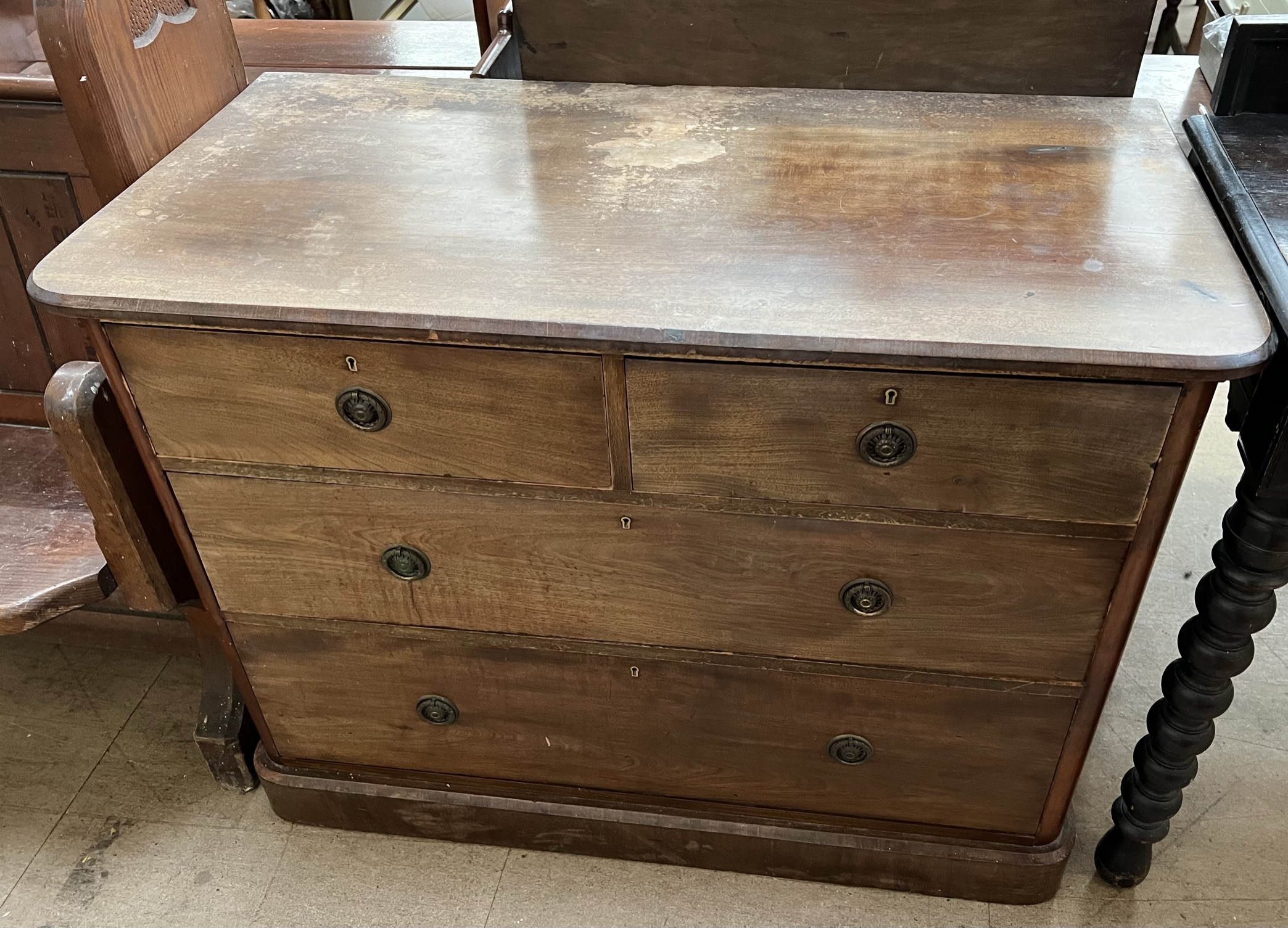 A Victorian mahogany chest with a rectangular top with rounded corners above two short and two long