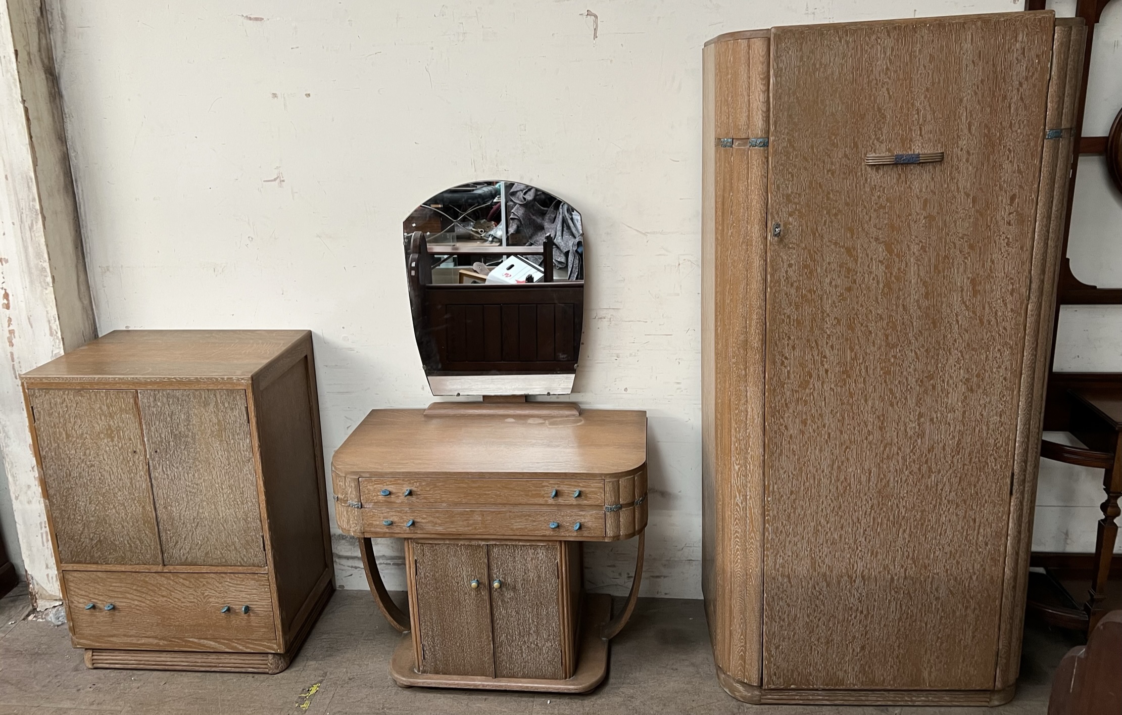 An early 20th century limed oak three piece bedroom suite