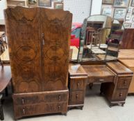 An early 20th century walnut wardrobe with a matching dressing table