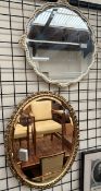A gilt oval wall mirror together with a white and gilt wall mirror and two bookplates of