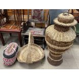 A Wicker Ali Baba lidded basket together with a swing handled basket and another case