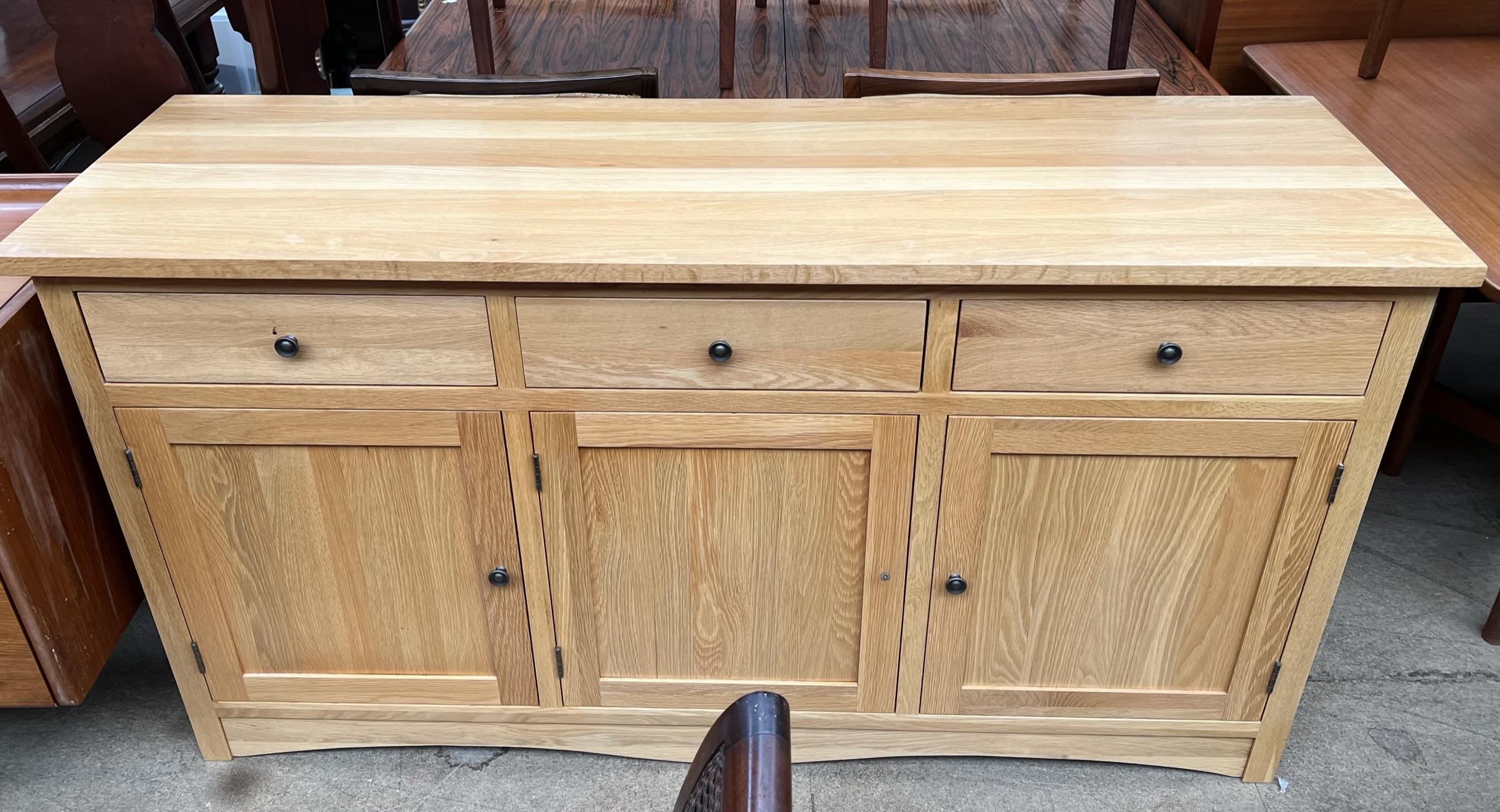 A 20th century dining table on square legs together with a set of four dining chairs and a matching