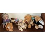 A Harrods 2001 Christmas Bear together with a collection of teddy bears and a doll