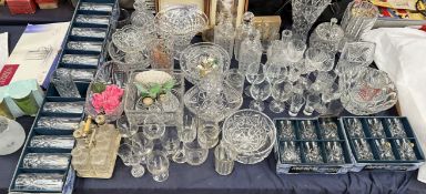 Crystal drinking glasses together with decanters,