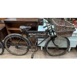 A Raleigh Tradesman's carrier bicycle with a carrier in the front,