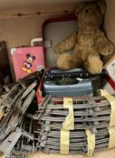 A Junior typewriter together with a teddy bear,