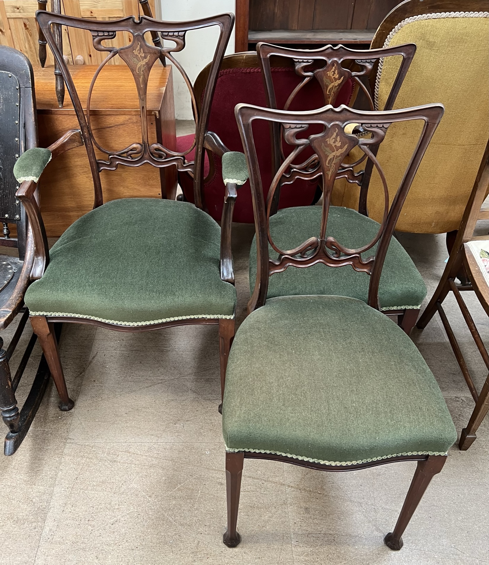 A set of three Art Nouveau mahogany salon chairs,