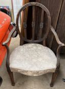 A Sheraton style mahogany dining chair with an oval back and pad seat on square tapering legs