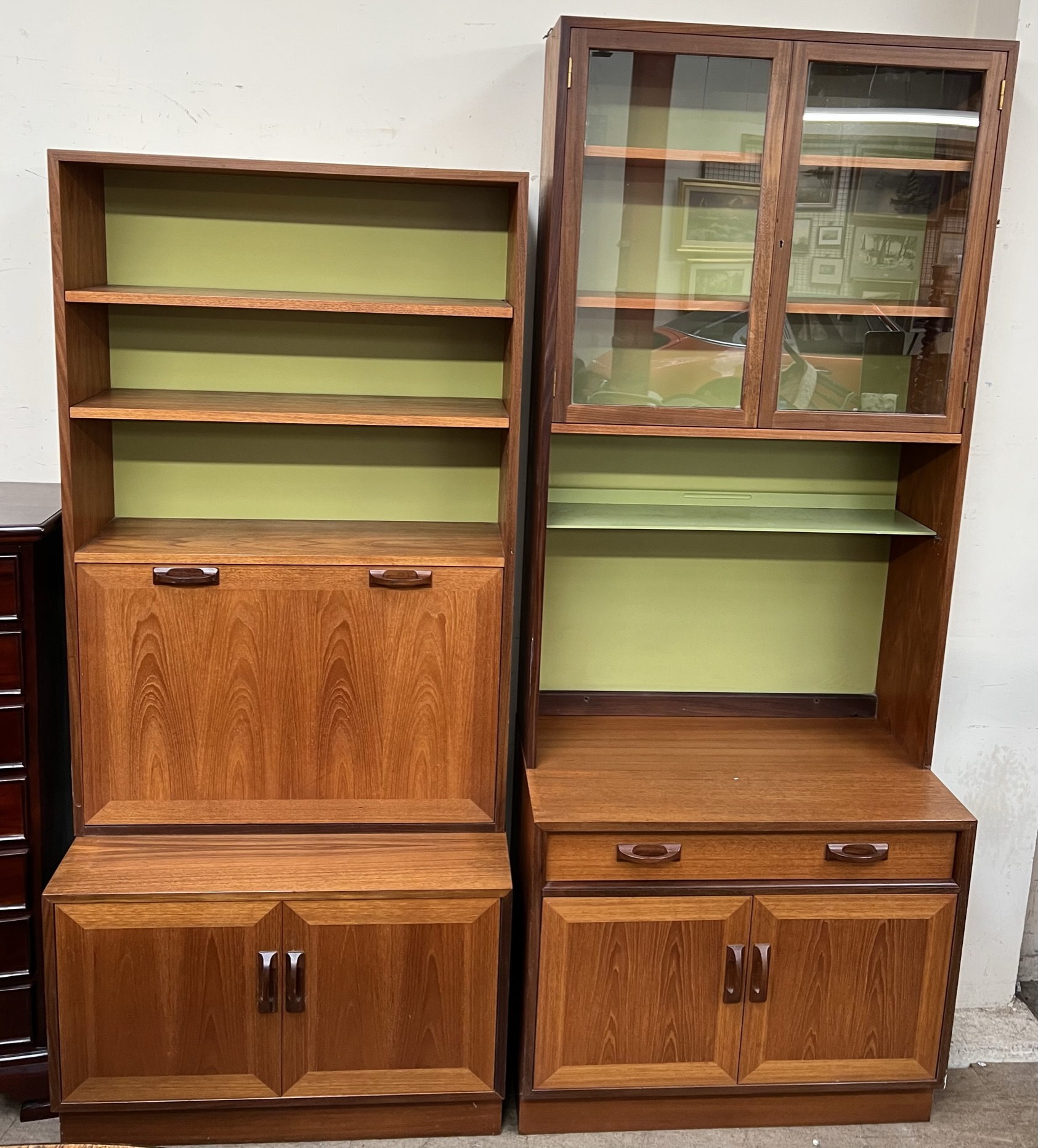 Two G-Plan teak wall units, one with shelves, drinks cabinet and cupboard doors,