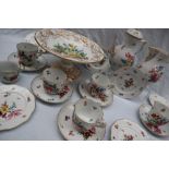 An Herend porcelain part tea service comprising a hot water pot, five tea cups,