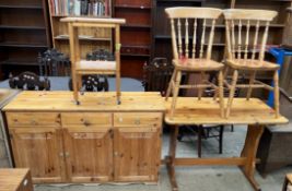 A pine dresser together with a kitchen pine table,