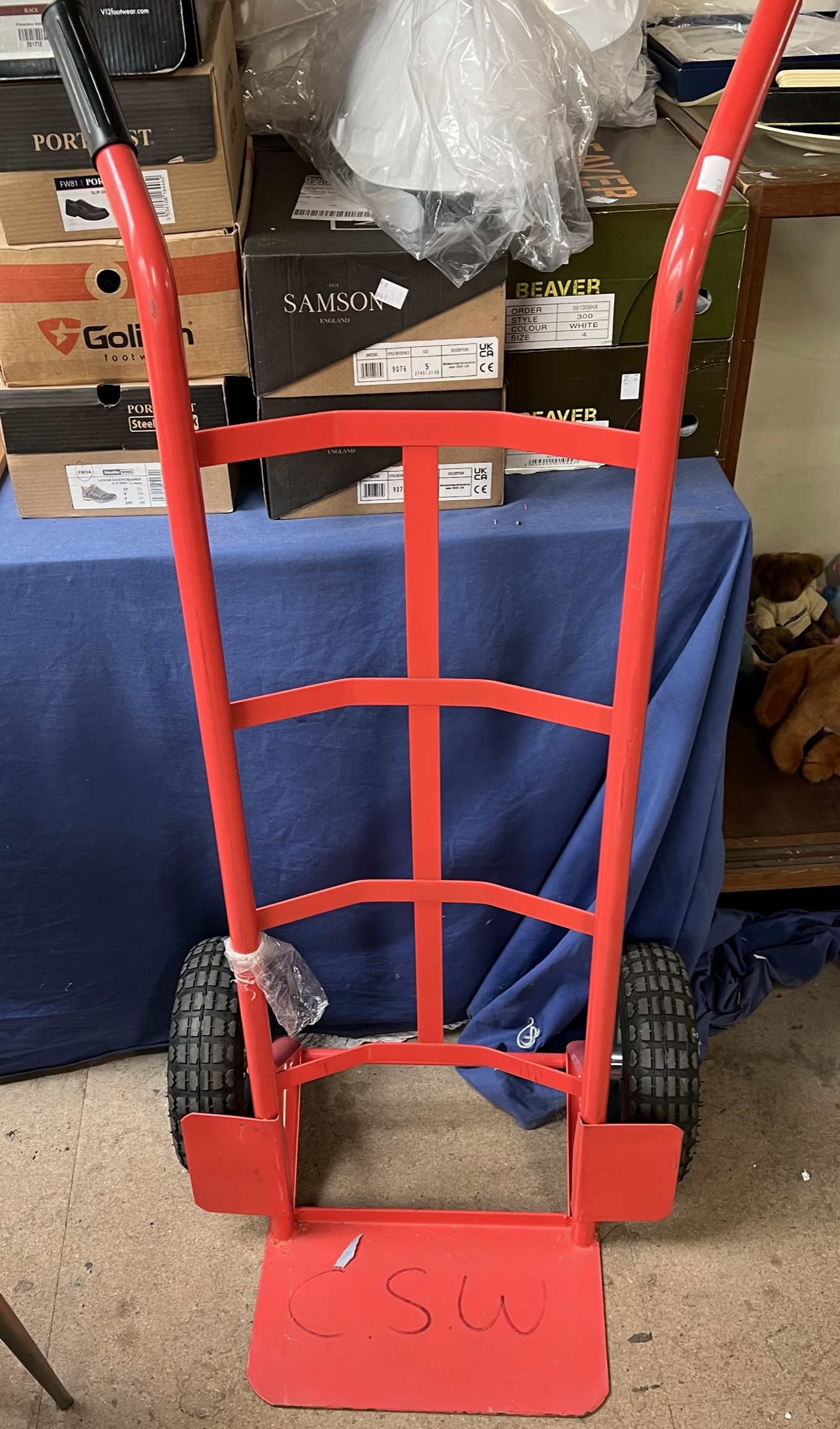 A sack truck in red with rubber tyres