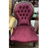 A Victorian mahogany framed nursing chair with a button back upholstered spoon back,