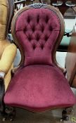 A Victorian mahogany framed nursing chair with a button back upholstered spoon back,