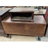 A 19th century oak gateleg dining table together with an oak hinged cabinet