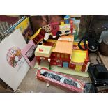A Fisher Price play family village together with records, cameras,
