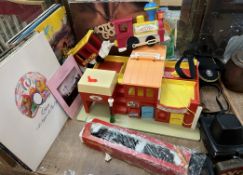 A Fisher Price play family village together with records, cameras,