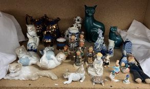 Poole pottery cats together with Hummel figures, Nao cat figures, copper lustre jugs,