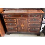 A 20th century mahogany side cabinet with a fold over top with drawers and a central cupboard