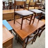 A mid 20th century White and Newton Ltd teak dining suite comprising an extending dining table six