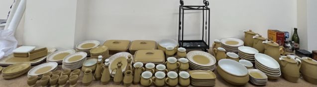 An extensive Denby stoneware part tea and dinner service including cups and saucers,