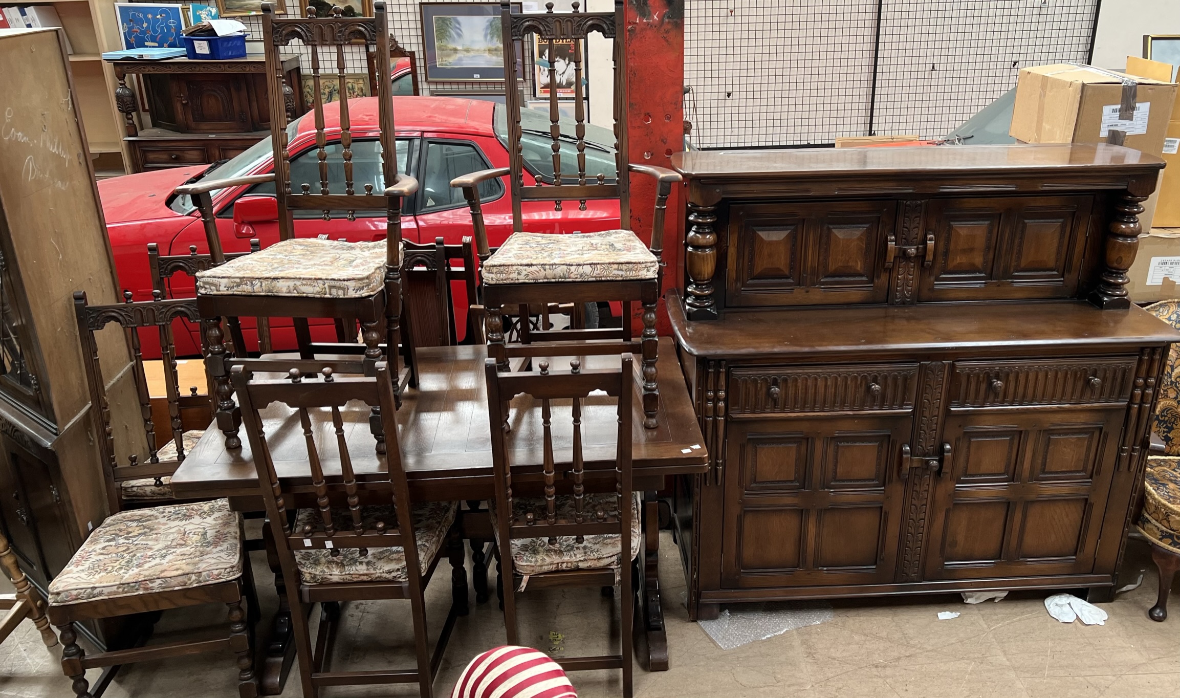 An Ercol oak extending dining table and eight chairs together with a court cupboard, - Image 2 of 3