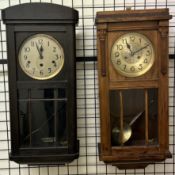 An ebonised oak wall clock,