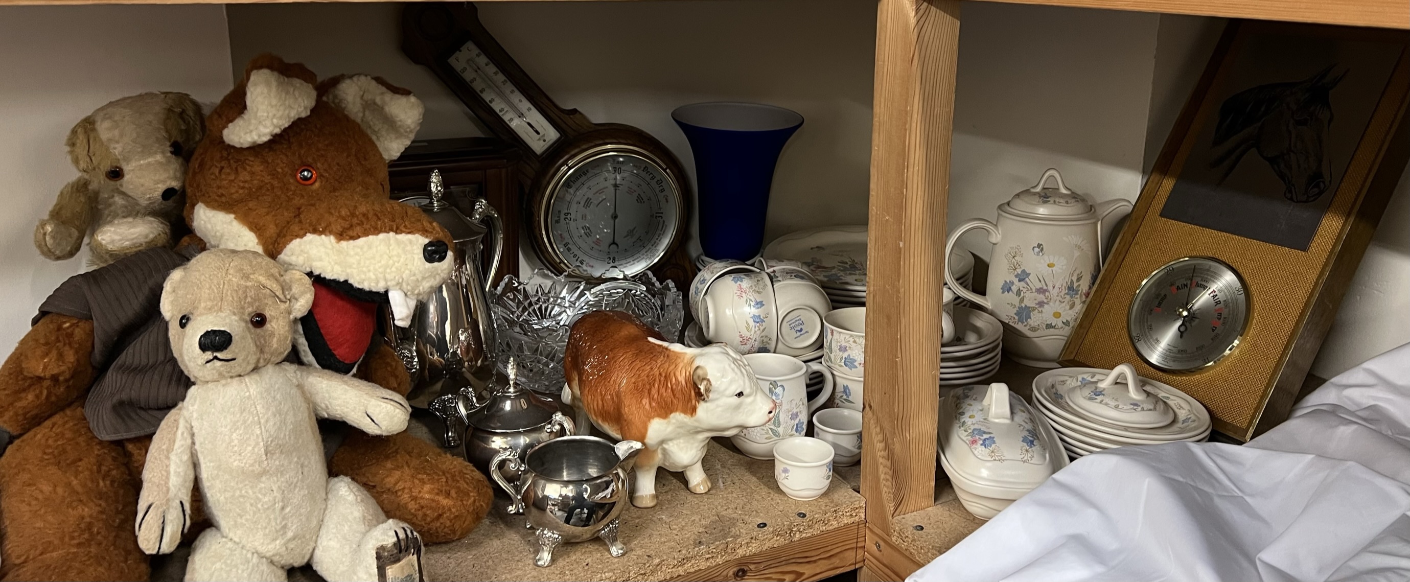 A Poole pottery part tea and dinner set together with barometers, clock, pottery bull,