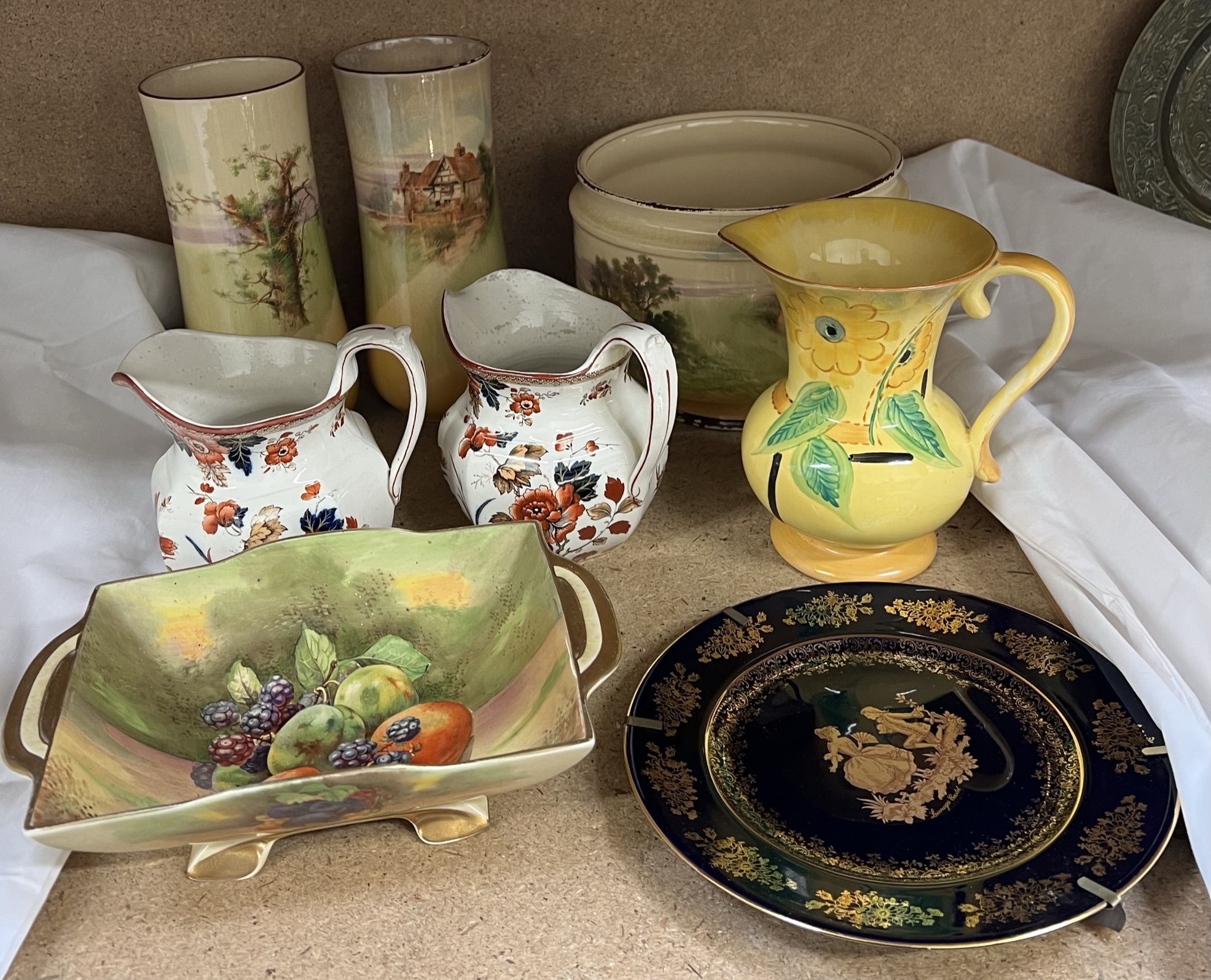 A pair of Royal Doulton vases together with a jardiniere, jugs,