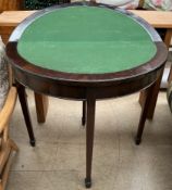 A mahogany card table with a circular fold over top on square tapering legs and spade feet