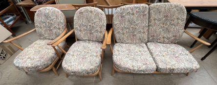 An Ercol three piece suite comprising a two seater settee and two armchairs CONDITION