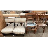 A pair of Edwardian nursing chairs together with a bedroom chair and a kitchen chair