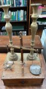 A pair of brass candlesticks together with a mahogany and brass folding scales