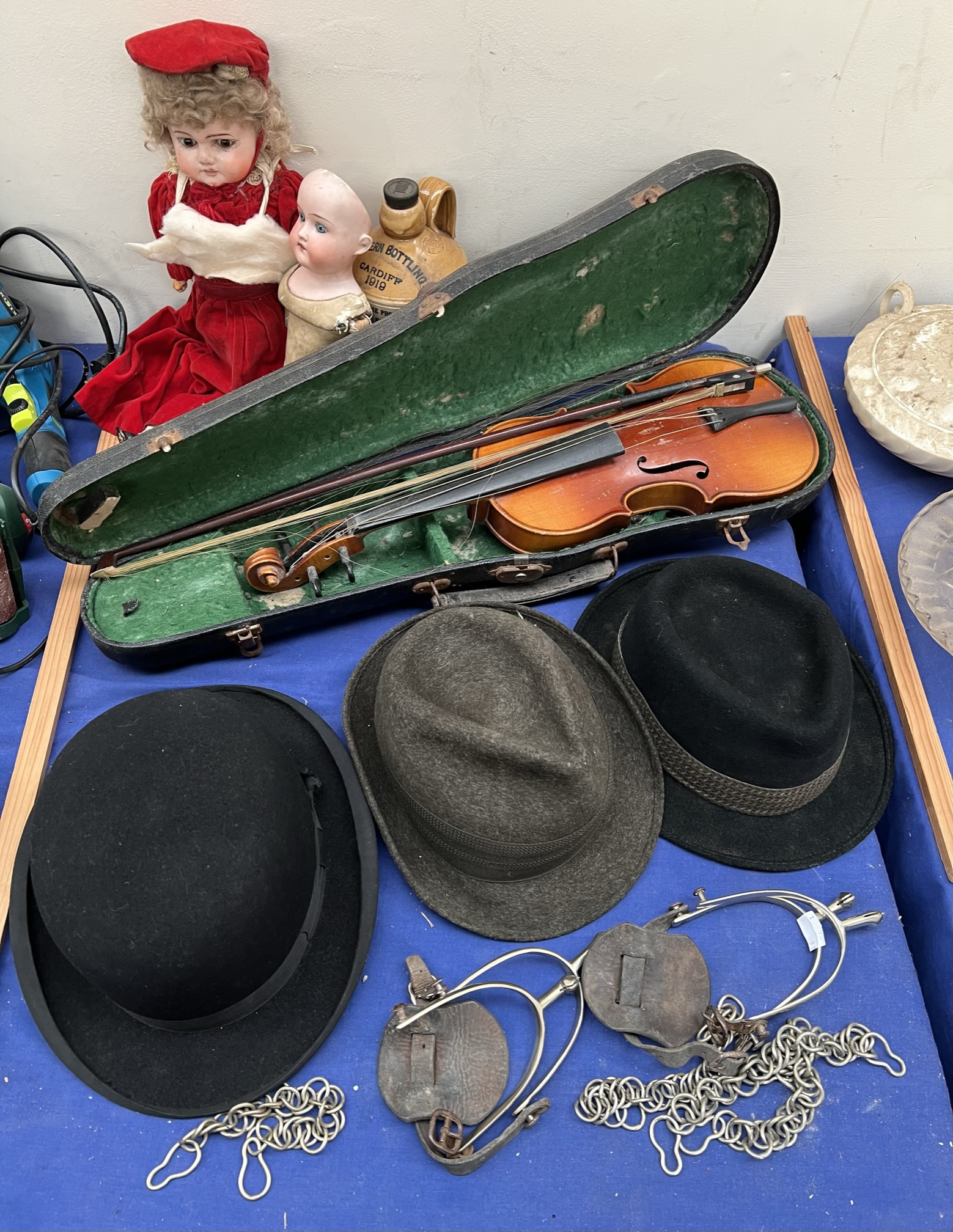 An Armand Marseille doll together with another doll, violin, bow,