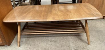 An Ercol light elm coffee table with a rectangular top on tapering legs