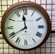 A Railway type timepiece with a mahogany frame and circular dial with Roman numerals inscribed